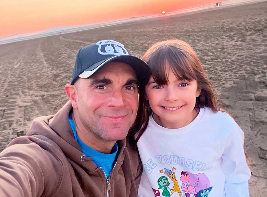 Paul McCabe business coach for professionals with his daughter reflecting work life balance
