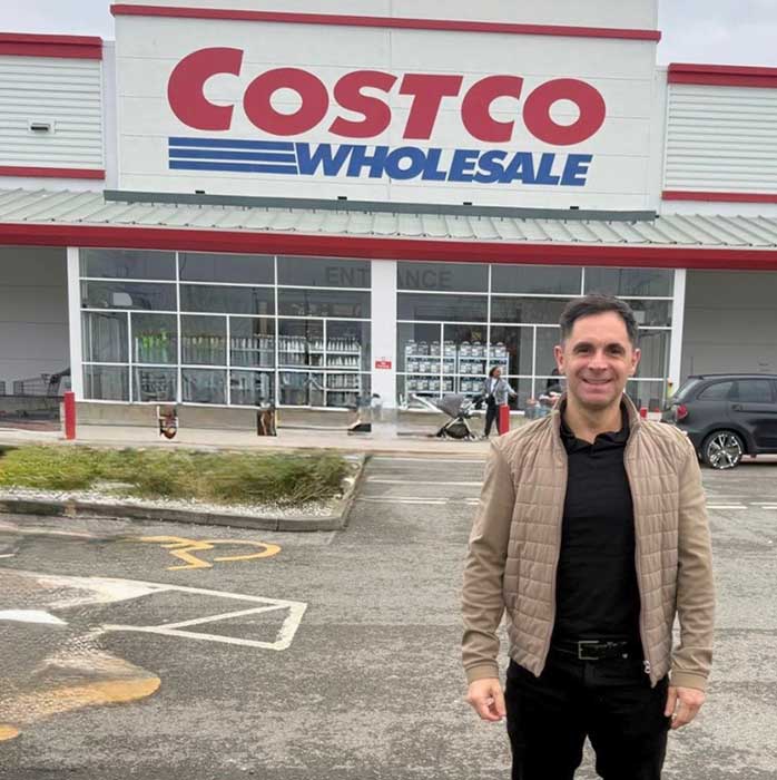 Paul McCabe business coach for professionals outside Costco reflecting business experience